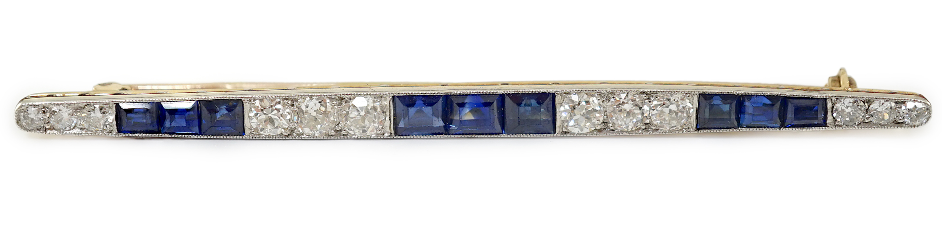 An Art Deco, round cut diamond and rectangular cut sapphire cluster bar brooch